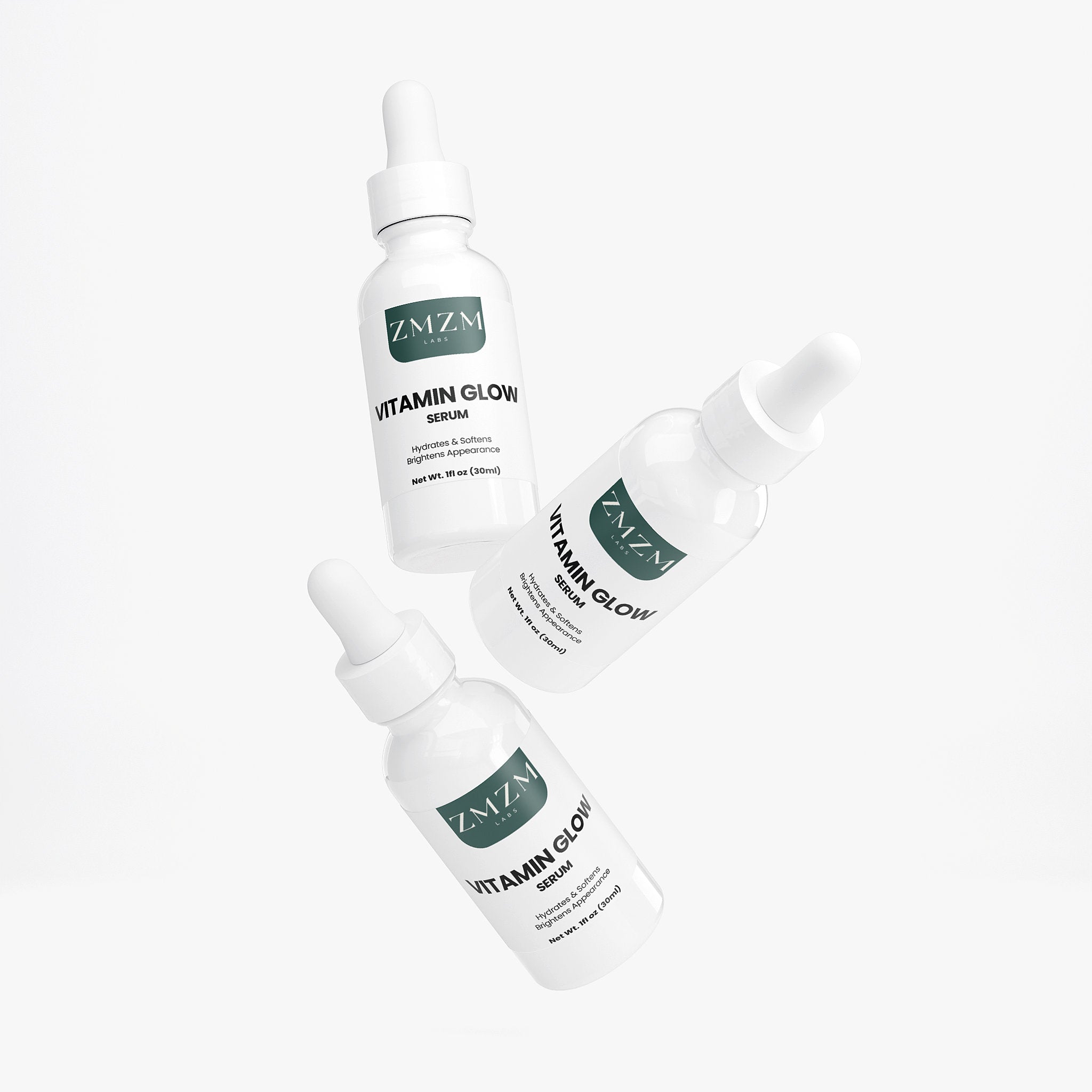 Three bottles of ZMZM Labs Vitamin Glow Serum on a white background