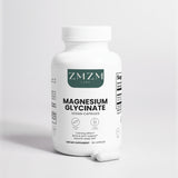Bottle of ZMZM Labs Magnesium Glycinate capsules on a light gray background