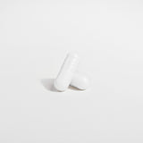 White pill  on a light gray background