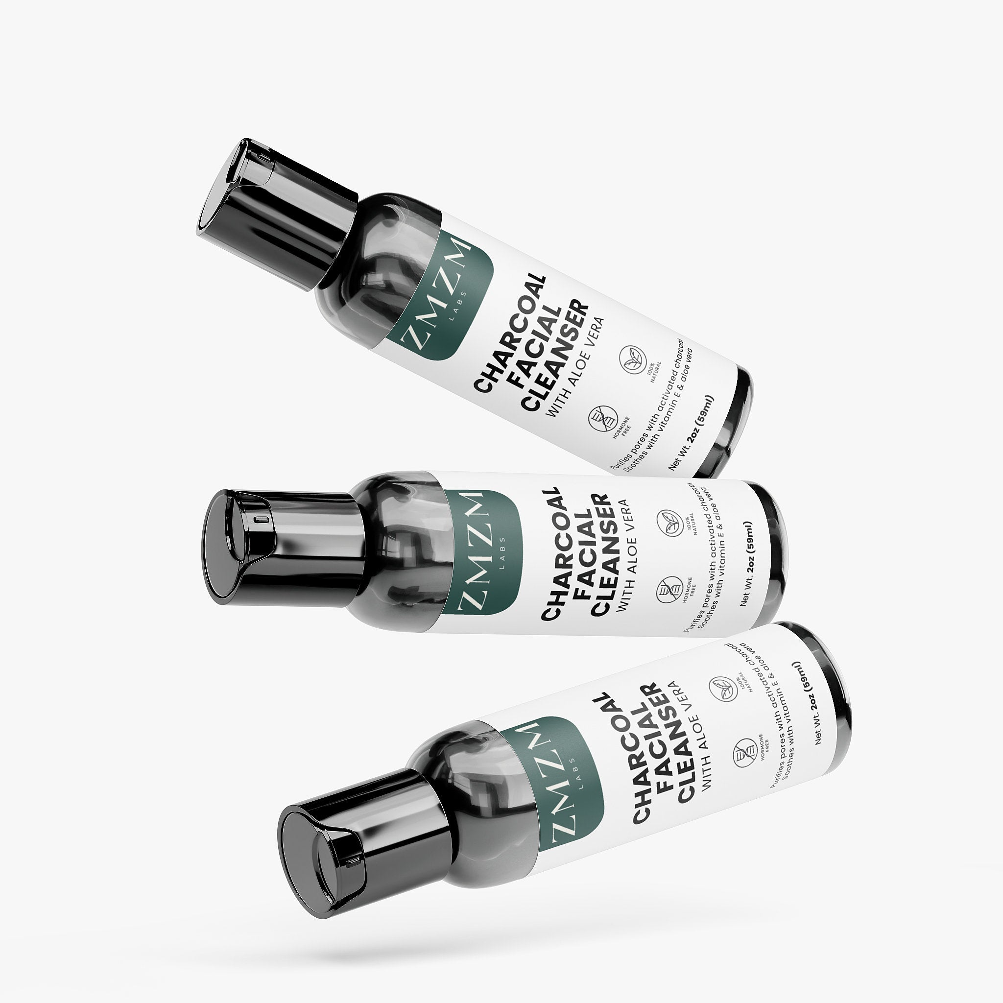 Three bottles of ZMZM Labs Charcoal Facial Cleanser on a white background